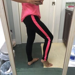 Black yoga pants with pink stripe